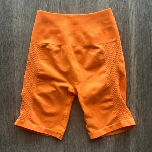 Alphalete Seamless Biker Shorts 7&quot; | Orange | Size S
